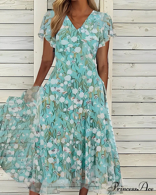 Fitted short-sleeved dress with floral print Green / S