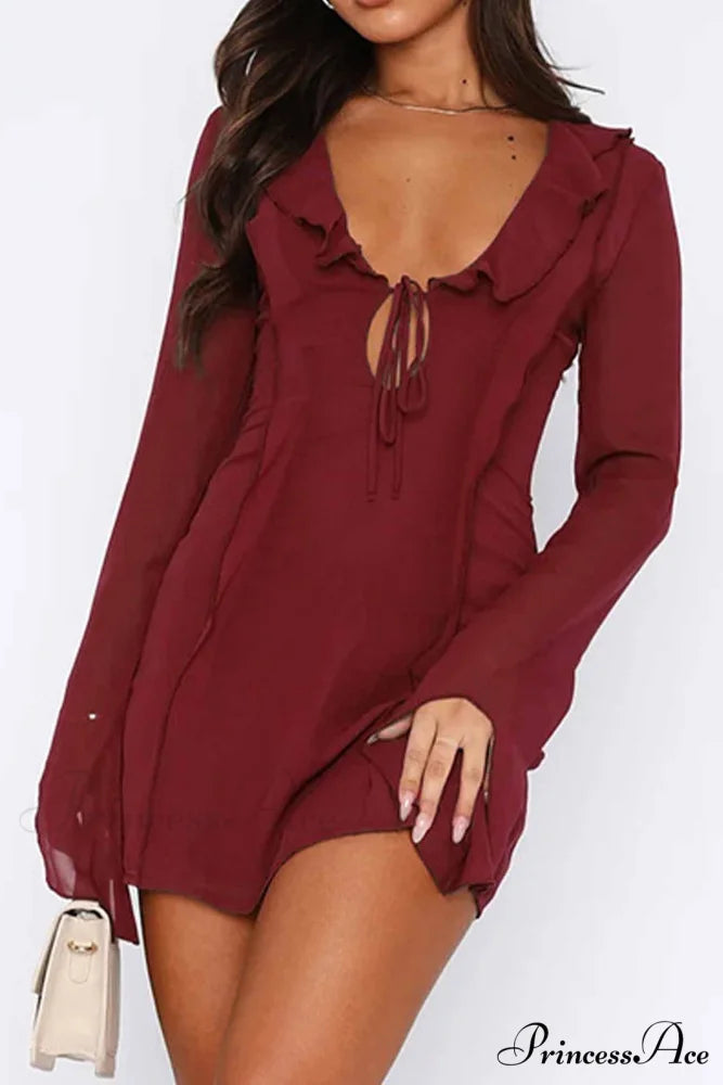 Long Sleeved Ruffled Mini Dress with Lace Up Detail