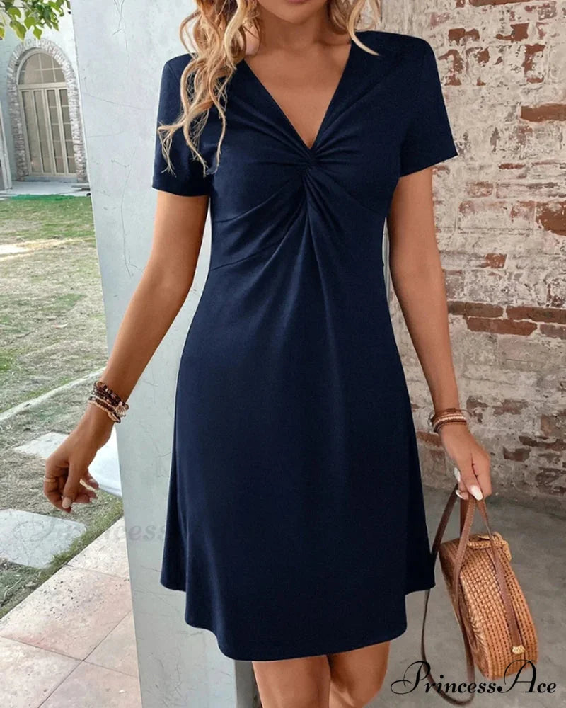 V Neck Dress with Twist Front Input: High Waisted Skinny Jeans Output: High Waisted Skinny Denim Pants Input: Floral